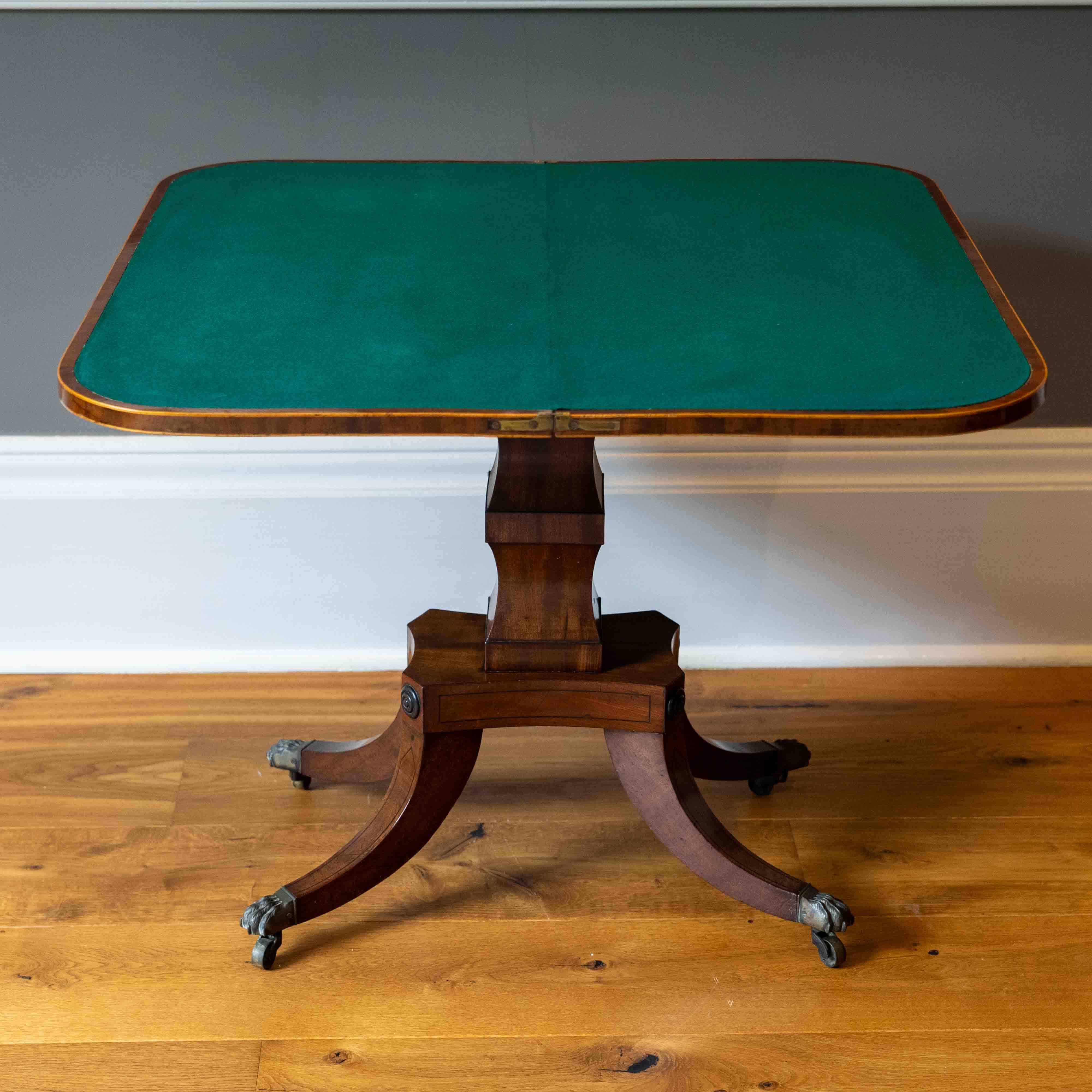 A George IV satinwood banded mahogany D shaped folding card table, width 90cm, depth 44cm, height 72cm. Condition - good